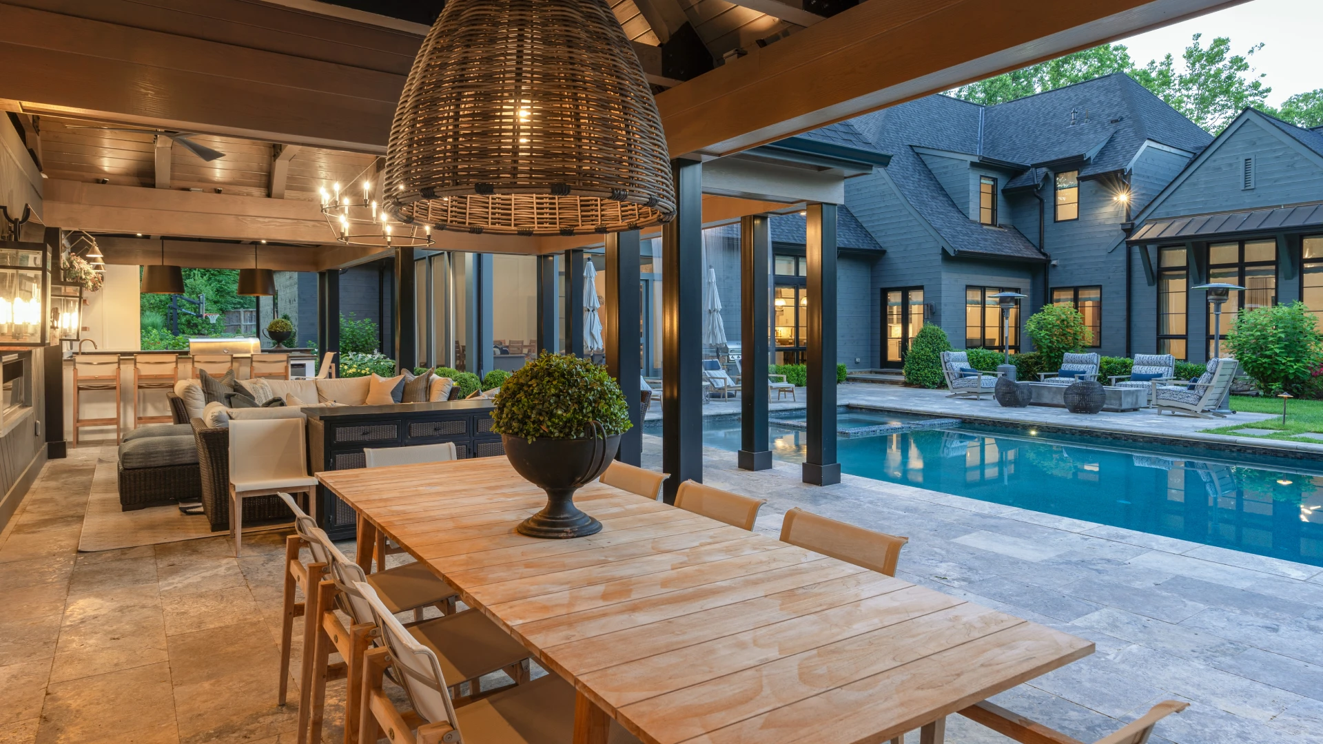 Fulfilling a homeowner's wish to create a custom outdoor area that encapsulated all elements of outdoor living: cooking, relaxation, living, dining, bath, and pool and spa.