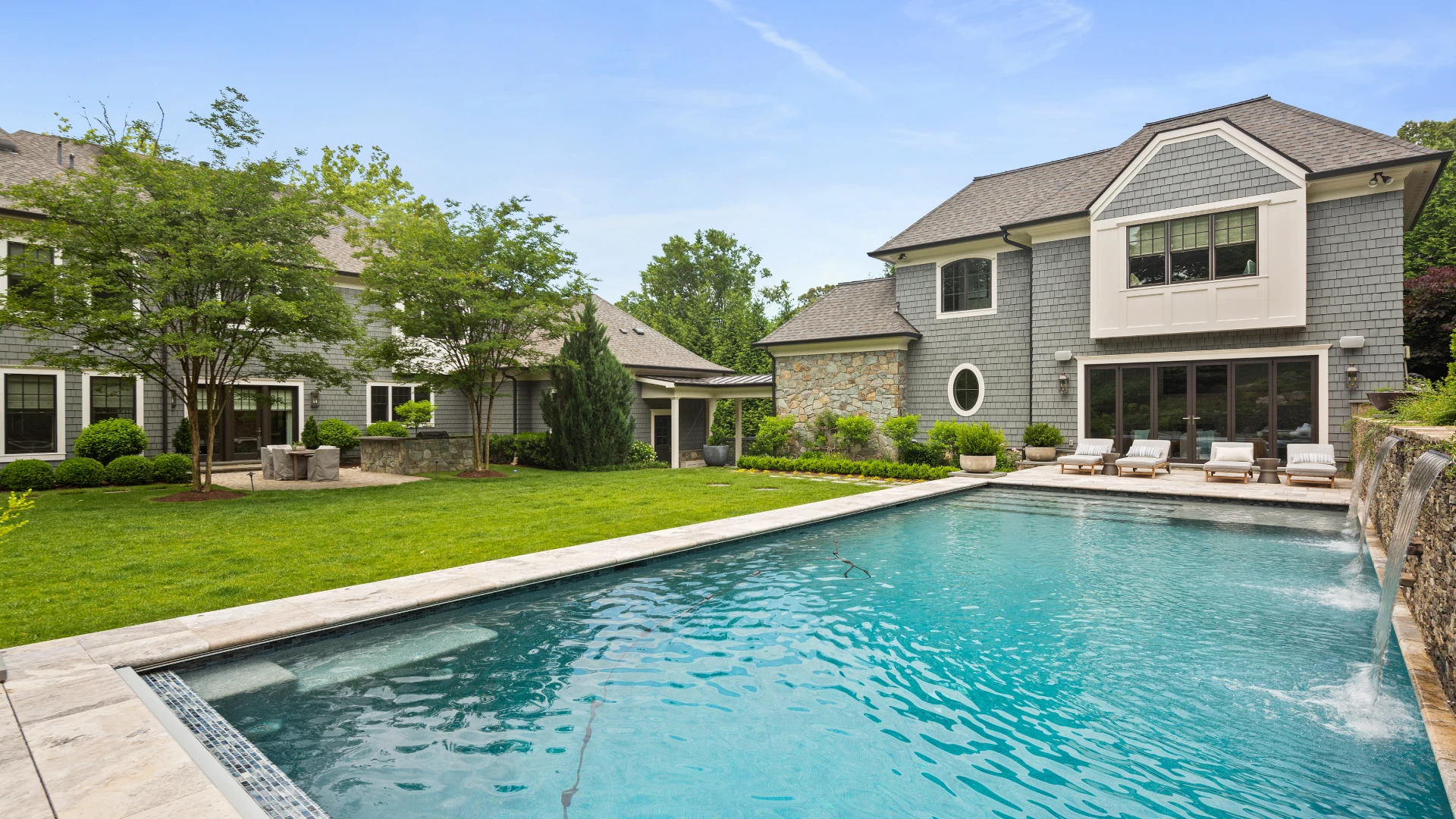 A pool and poolhouse combination that epitomizes outdoor luxury and recreation.